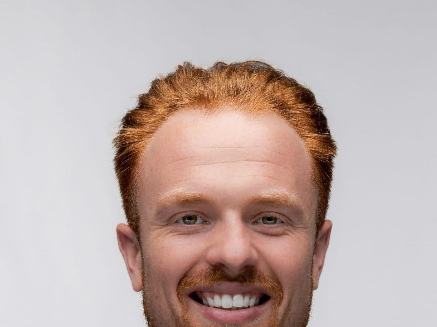 Darragh Gibbs, founder of Built For Both, in a blue suit and white shirt