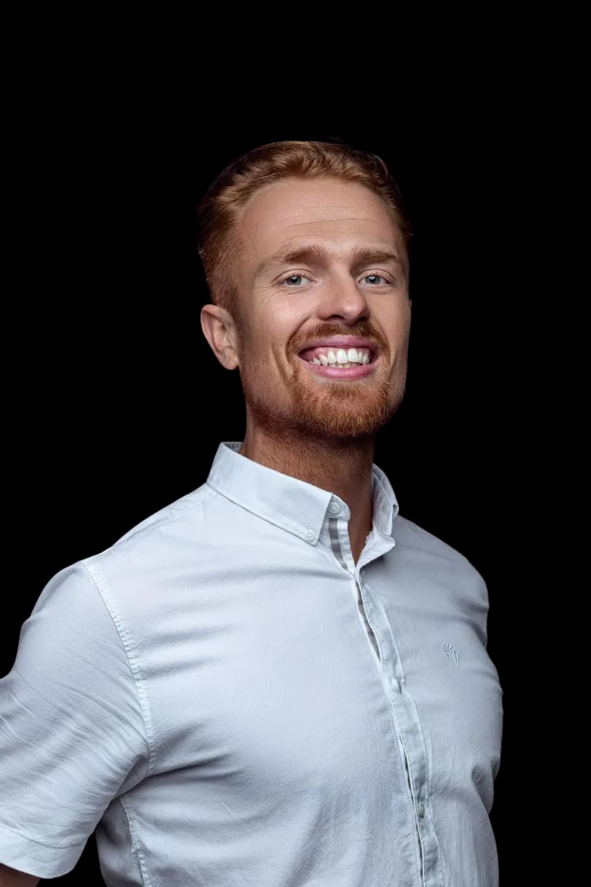 Darragh Gibbs, founder of Built For Both, in a white shirt, smiling